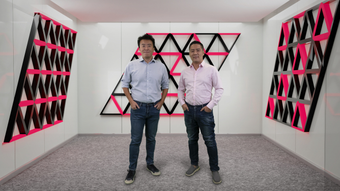Figure 1. Research Assistant Professor Zheng YAN (on the right) and Associate Professor Zi Yang MENG from HKU Department of Physics standing in the imaginary space decorated with the novel quantum states they discovered. The HKU Physics team and their collaborators designed a soft-constrained model to describe the programmable quantum simulator and predict the novel entangled states on it. The research work has been published in Nature Communications recently.